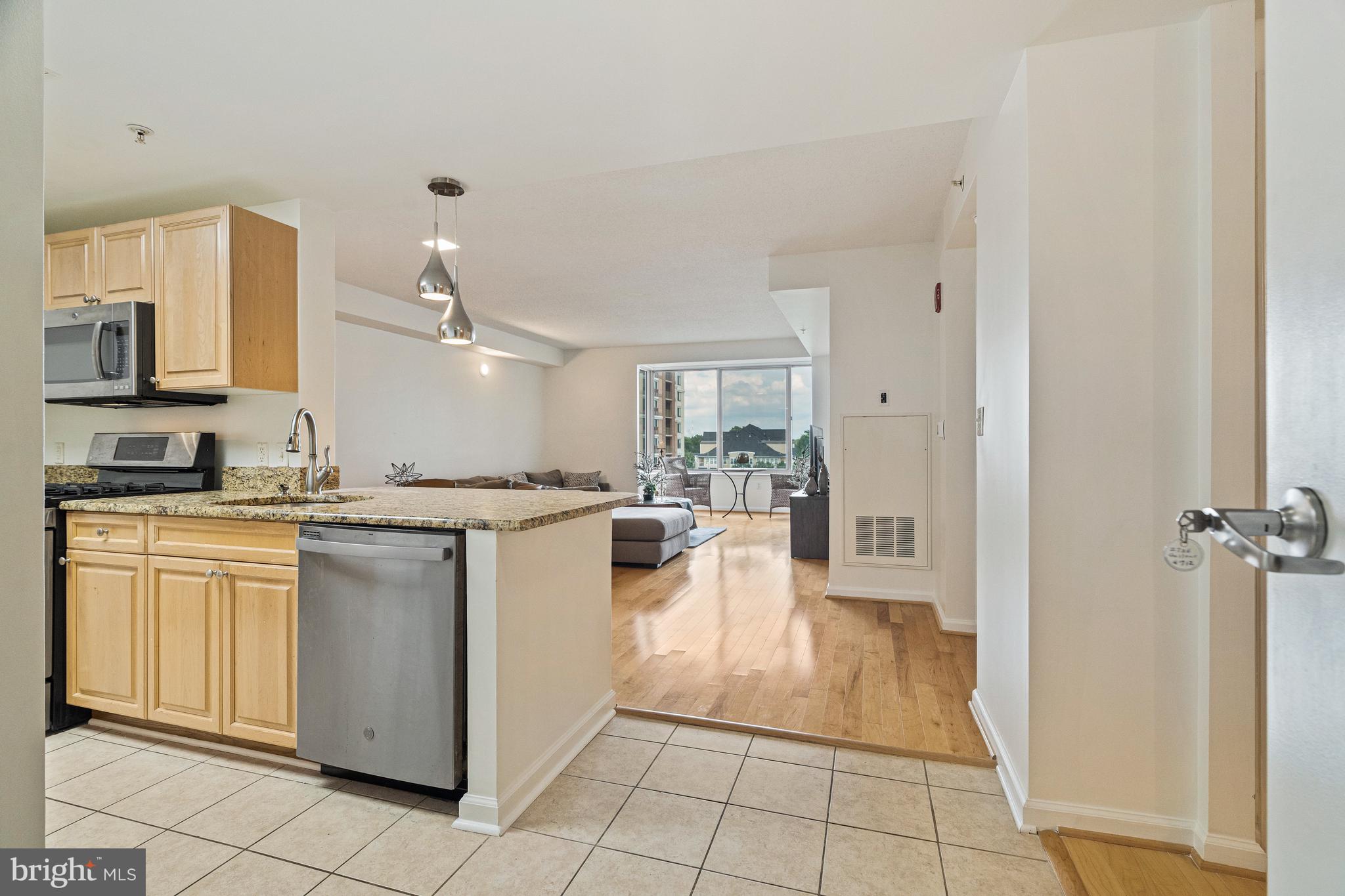 2726 Gallows Road, Unit 712 Vienna, VA 22180 - Photo 3 of 55 a kitchen with stainless steel appliances granite countertop a refrigerator and a sink