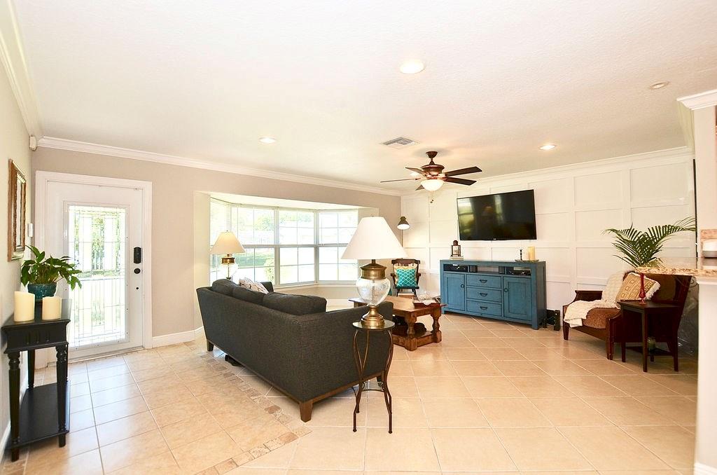 459 Southwest Byron Street Port St. Lucie, FL 34983 - Photo 12 of 51 a living room with furniture and a flat screen tv