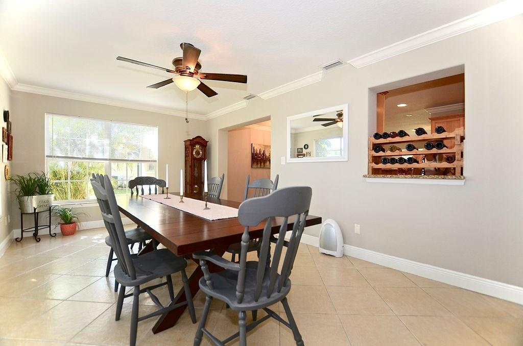 459 Southwest Byron Street Port St. Lucie, FL 34983 - Photo 21 of 51 a dining room with furniture and window
