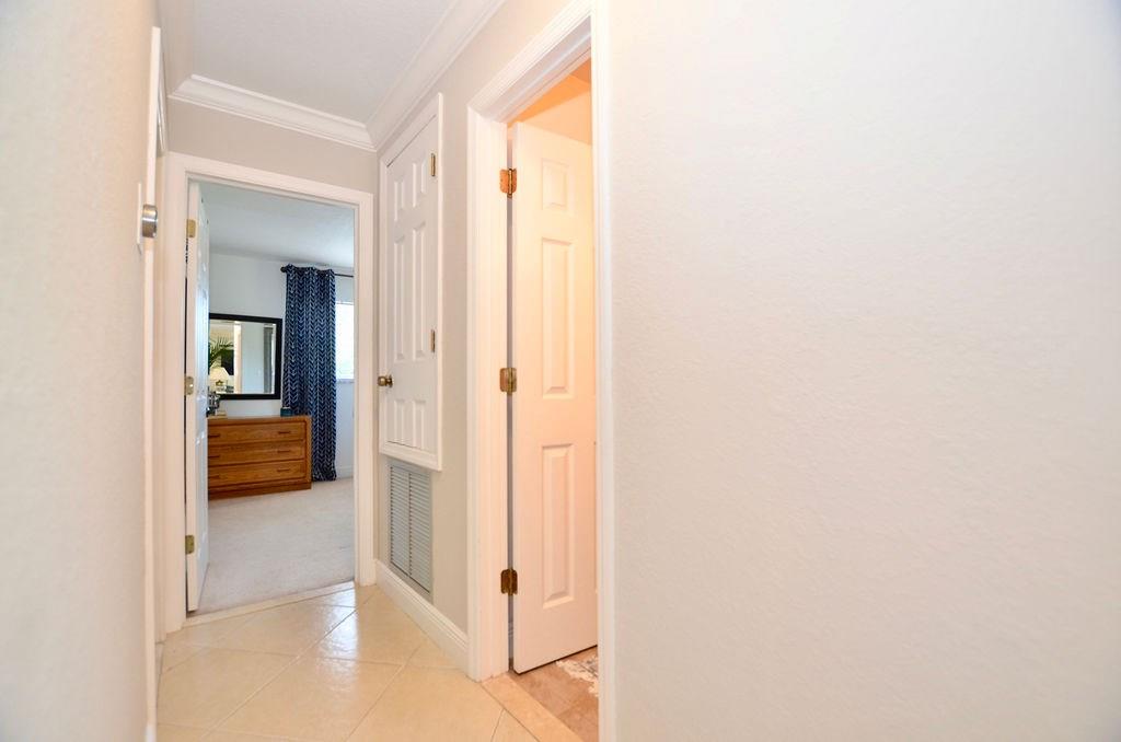 459 Southwest Byron Street Port St. Lucie, FL 34983 - Photo 23 of 51 a view of a bedroom from a hallway