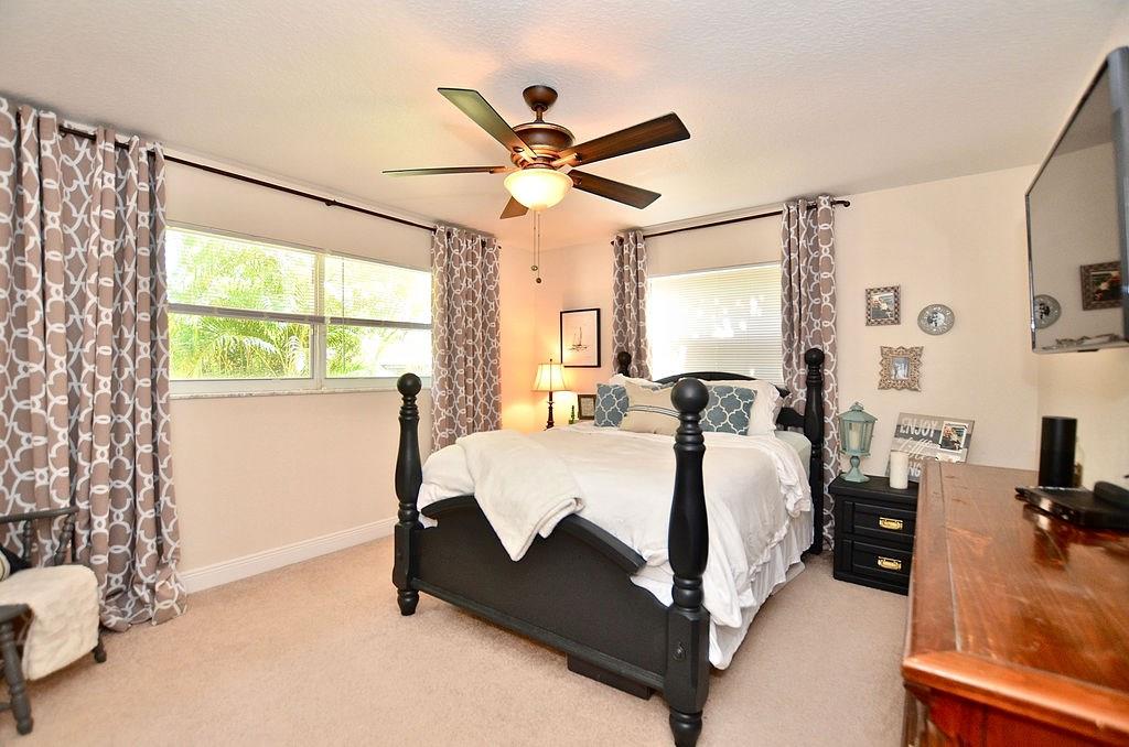459 Southwest Byron Street Port St. Lucie, FL 34983 - Photo 29 of 51 a bed room with a bed and a window