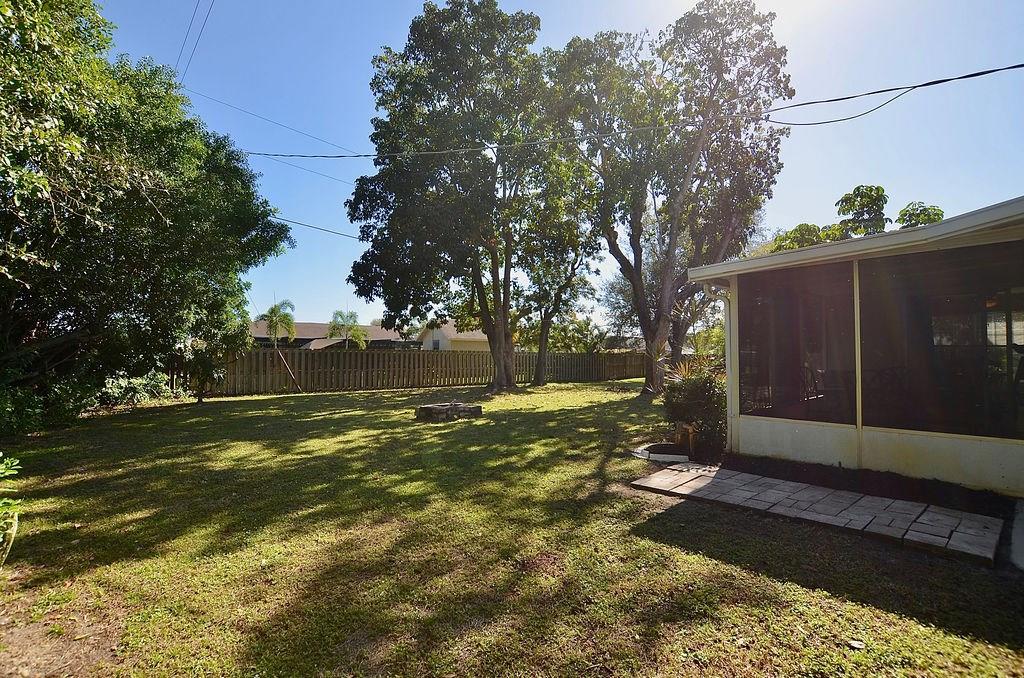 459 Southwest Byron Street Port St. Lucie, FL 34983 - Photo 38 of 51 a view of yard with tree