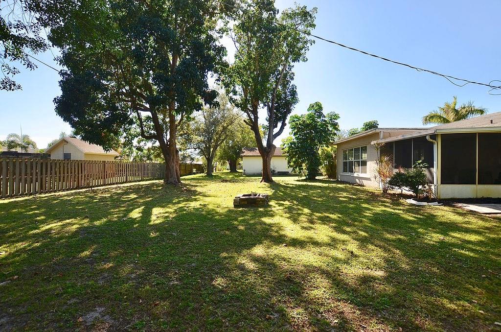 459 Southwest Byron Street Port St. Lucie, FL 34983 - Photo 39 of 51 a view of outdoor space with a garden