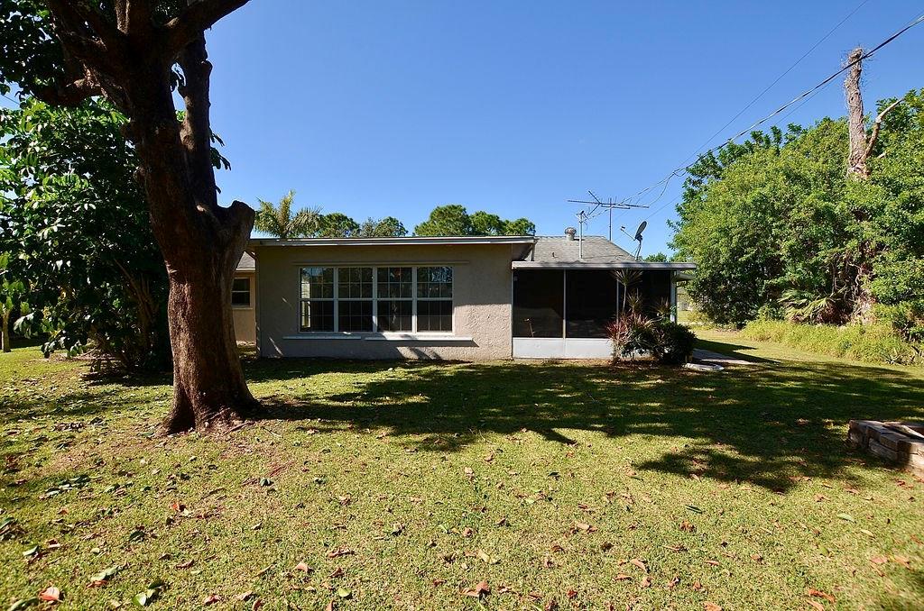 459 Southwest Byron Street Port St. Lucie, FL 34983 - Photo 42 of 51 a view of a house with a yard