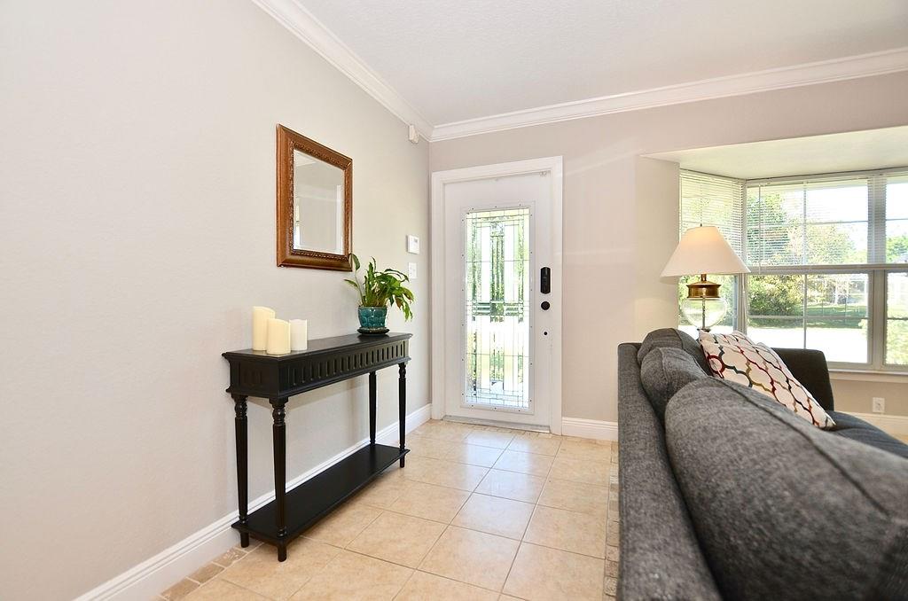 459 Southwest Byron Street Port St. Lucie, FL 34983 - Photo 5 of 51 a living room with furniture and a window