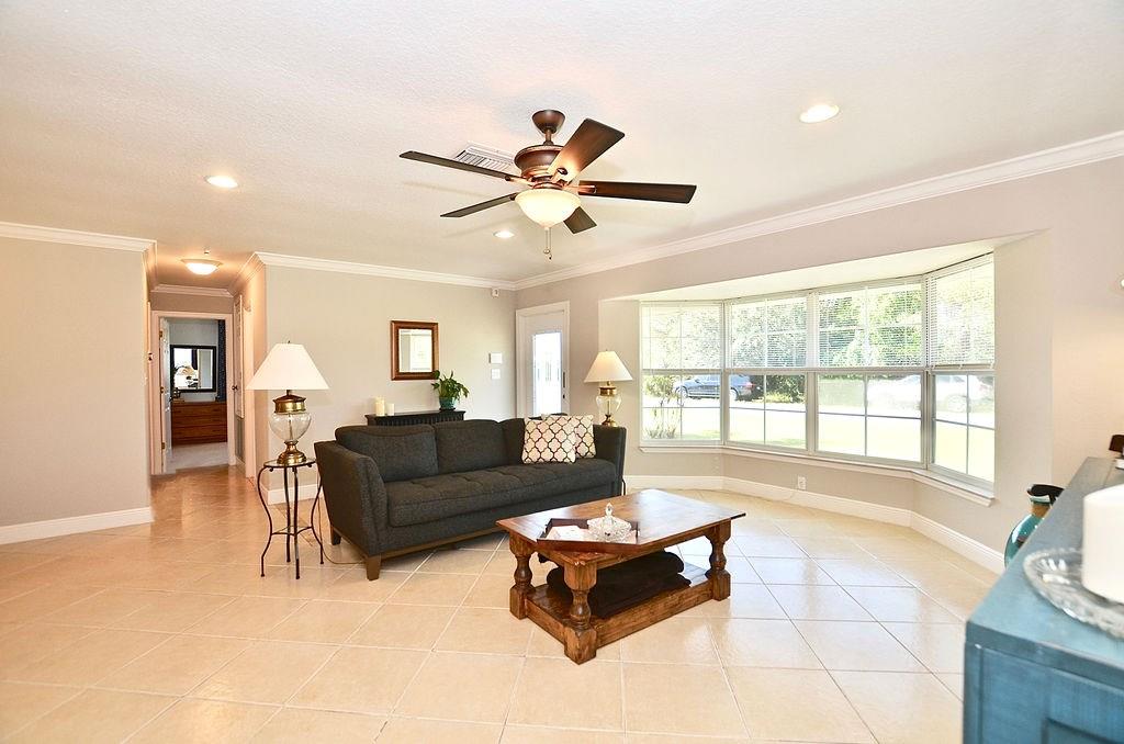459 Southwest Byron Street Port St. Lucie, FL 34983 - Photo 9 of 51 a living room with furniture and a large window with outer view