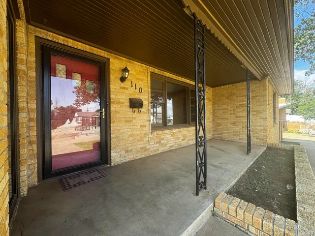 a view of a porch with a door