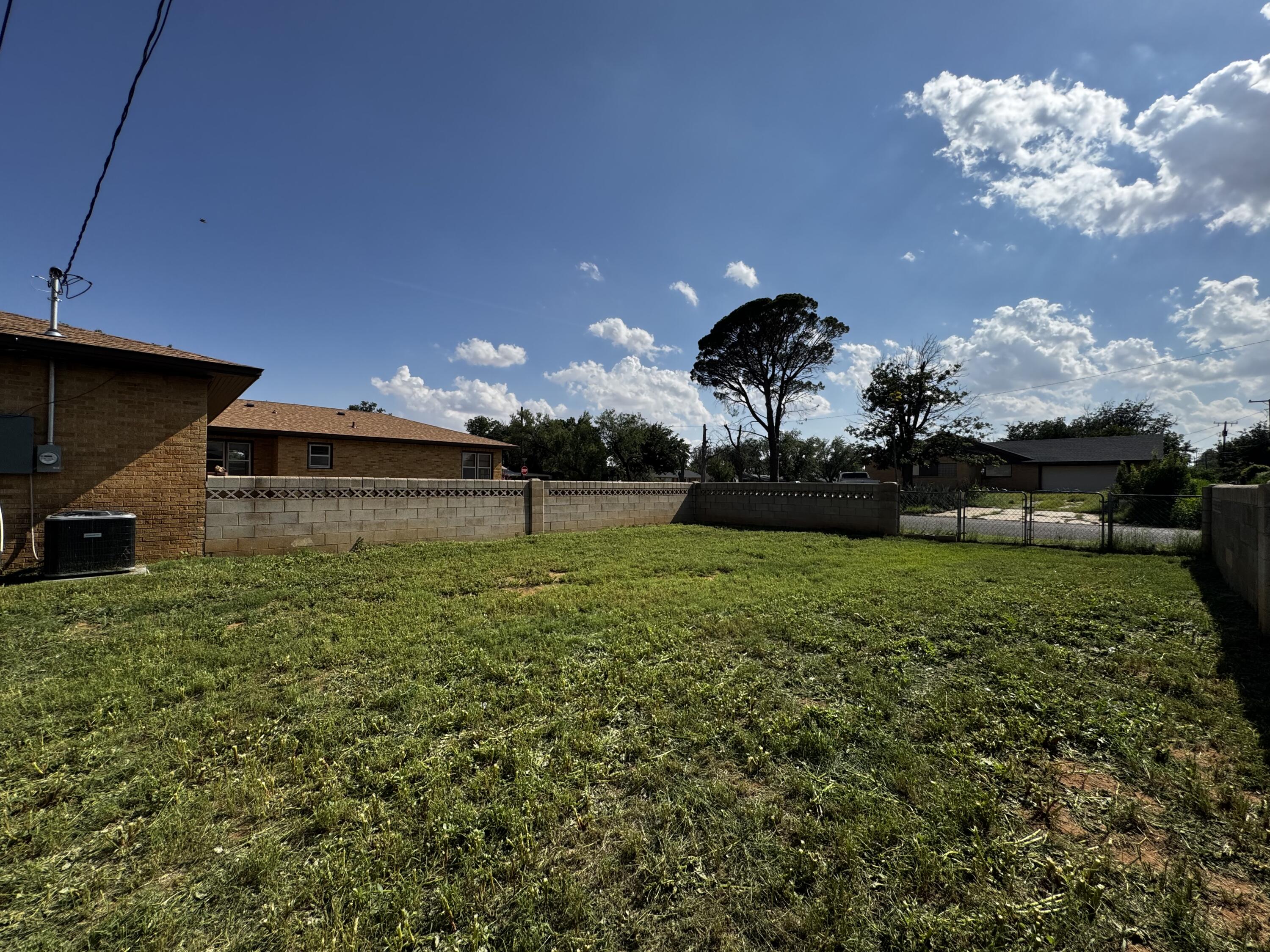 110 North 15th Street Lamesa, TX 79331 - Photo 27 of 28 a front view of a house with a garden