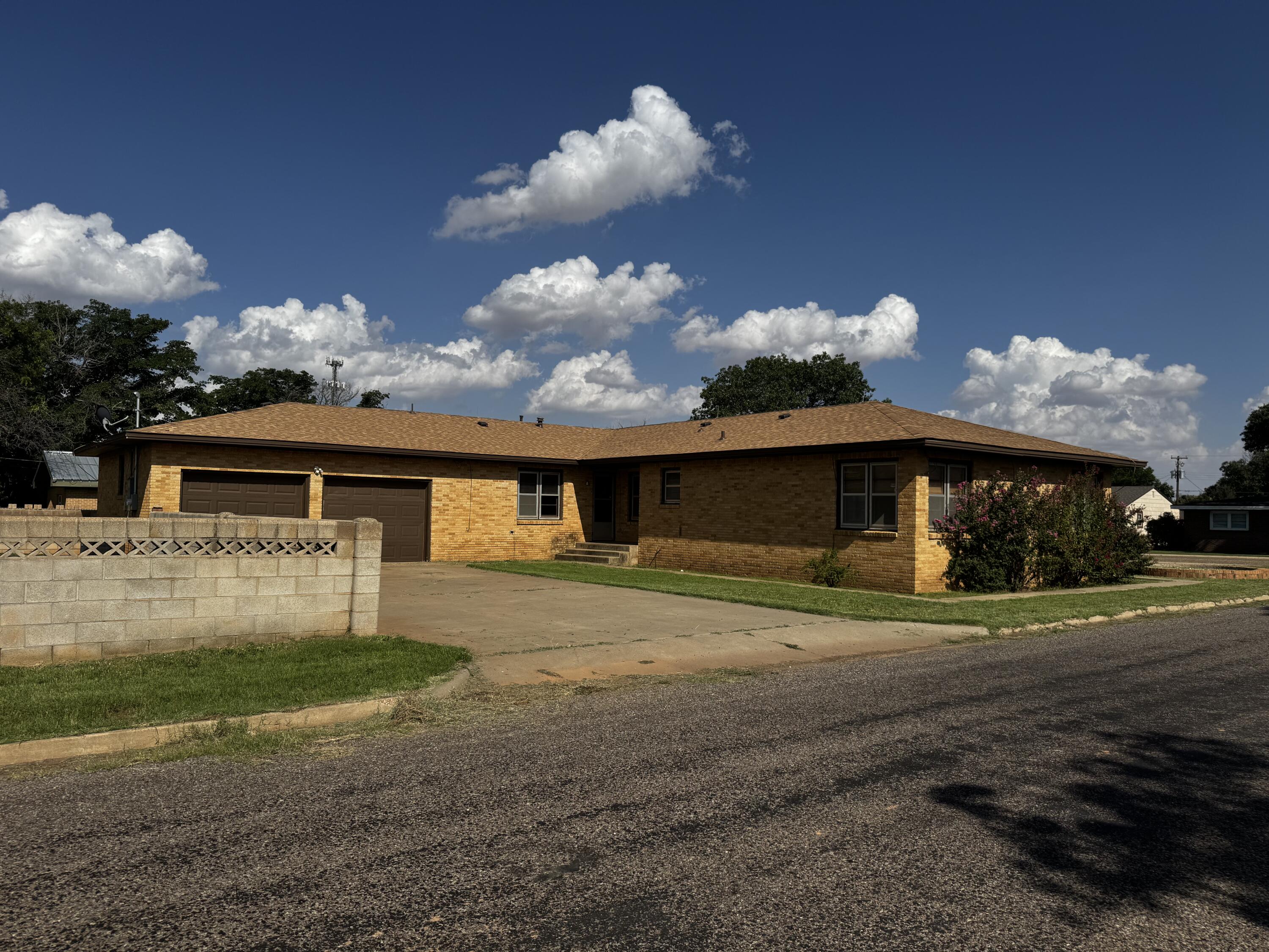 110 North 15th Street Lamesa, TX 79331 - Photo 5 of 28 a view of a house with a yard