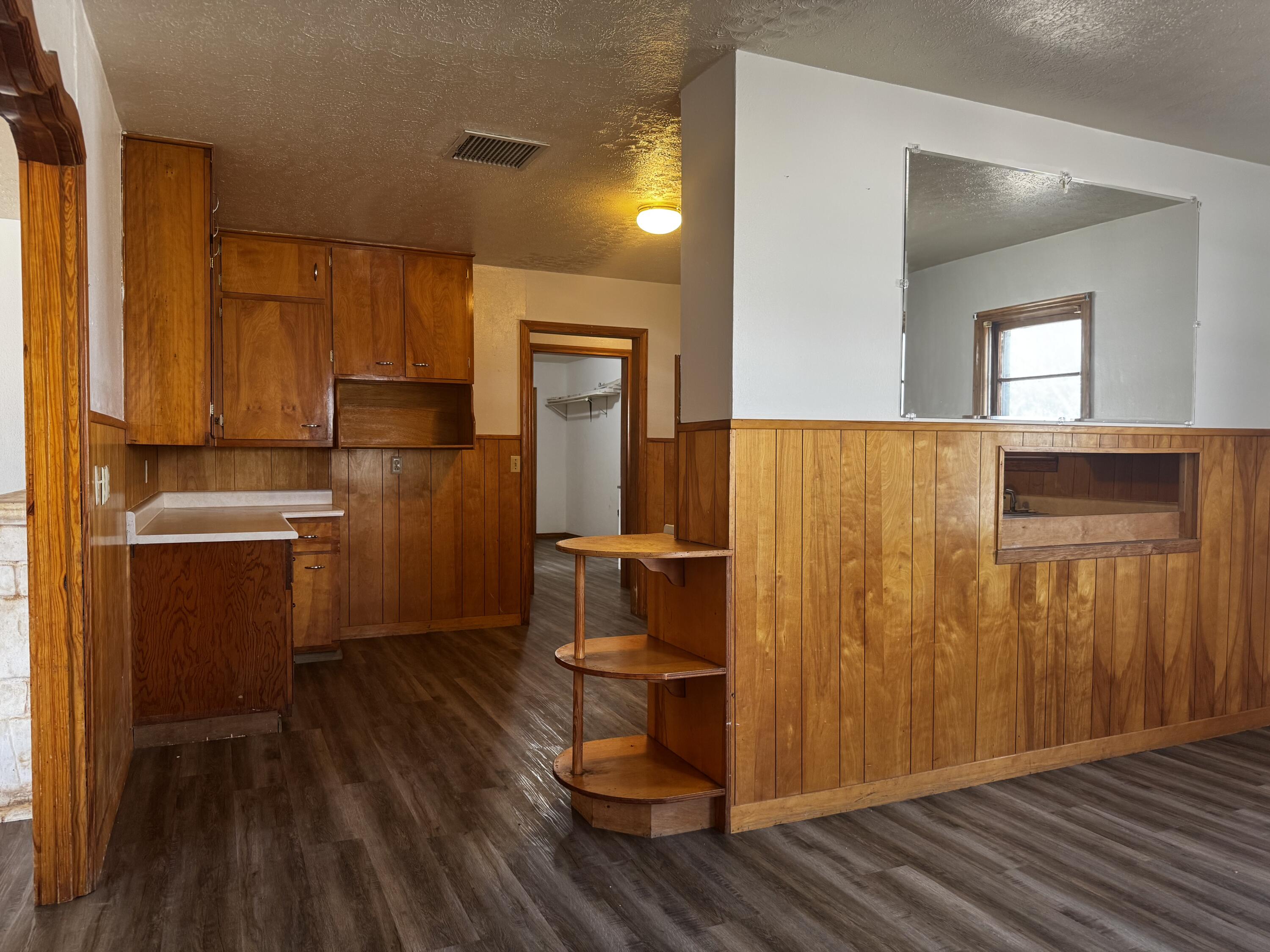 110 North 15th Street Lamesa, TX 79331 - Photo 10 of 28 a view of kitchen with wooden floor and electronic appliances