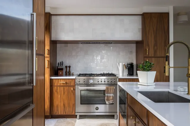 a kitchen with a stove and a refrigerator