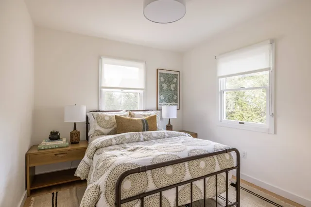 a bedroom with a bed and window