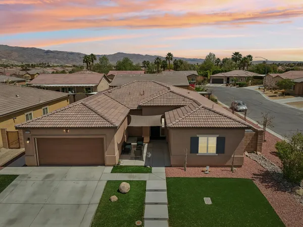 an aerial view of a house with a garden space