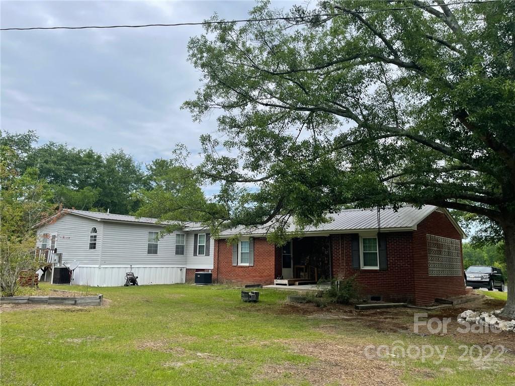 97 County Rd S-13-678 Jefferson, SC 29718 - Photo 4 of 24 a view of a house with a yard