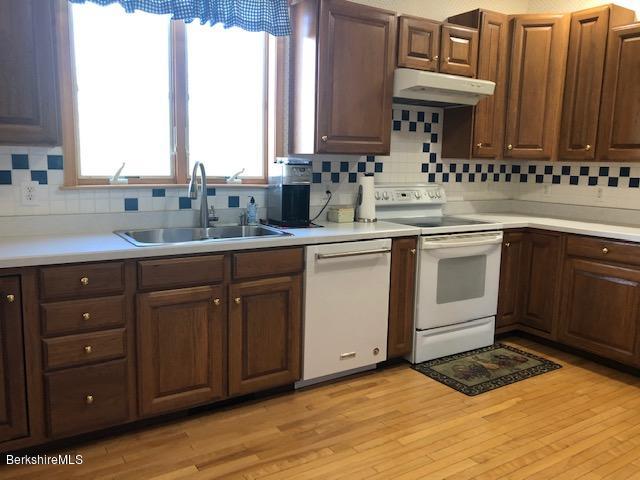 110 Hill Cemetery Road Windsor, MA 01270 - Photo 22 of 52 a kitchen with a sink and cabinets