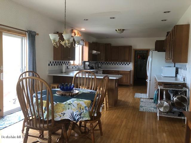 110 Hill Cemetery Road Windsor, MA 01270 - Photo 24 of 52 a view of a dining room with furniture and wooden floor