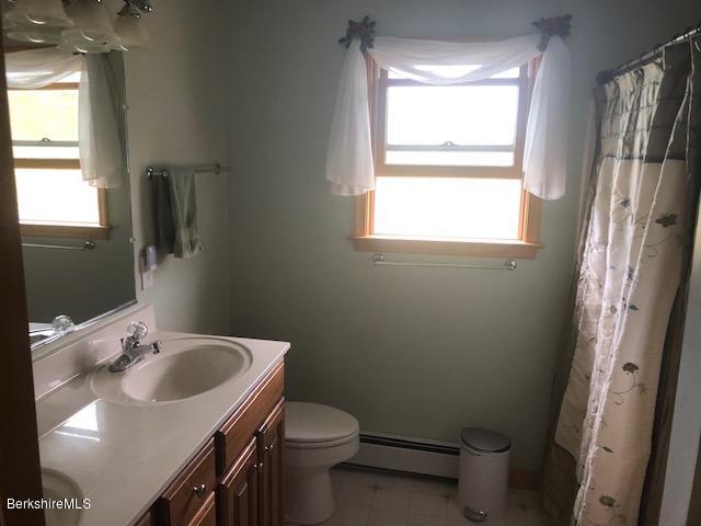 110 Hill Cemetery Road Windsor, MA 01270 - Photo 35 of 52 a bathroom with a sink toilet and a mirror