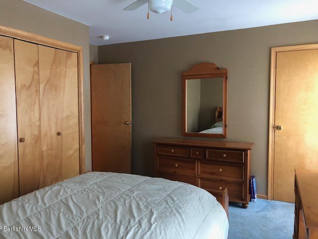 110 Hill Cemetery Road Windsor, MA 01270 - Photo 41 of 52 a bedroom with a bed and a dresser