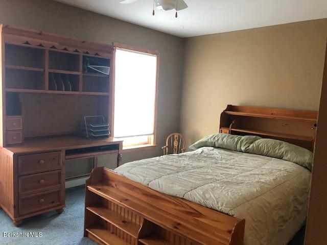 110 Hill Cemetery Road Windsor, MA 01270 - Photo 43 of 52 a bedroom with a bed and a dresser