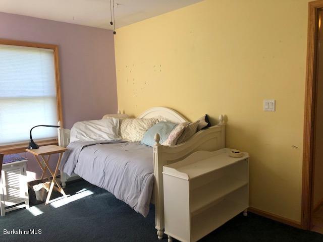 110 Hill Cemetery Road Windsor, MA 01270 - Photo 44 of 52 a bedroom with a bed and gym equipment