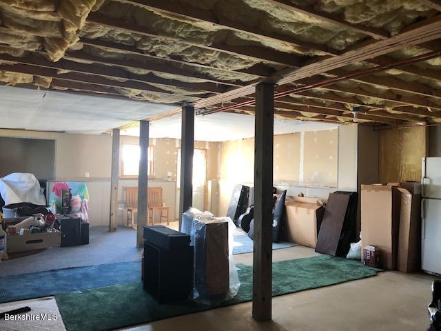 110 Hill Cemetery Road Windsor, MA 01270 - Photo 51 of 52 a living room with furniture and a floor to ceiling window