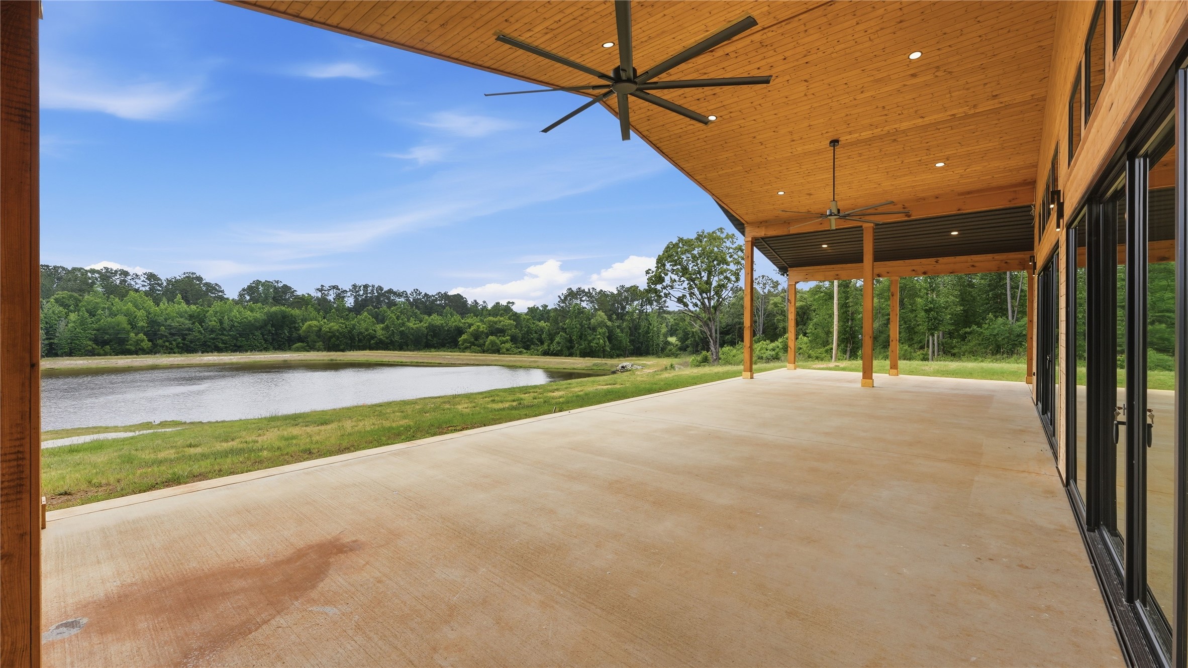447 County Road 2211 Rusk, TX 75785 - Photo 26 of 50 a view of a house with a swimming pool and a yard