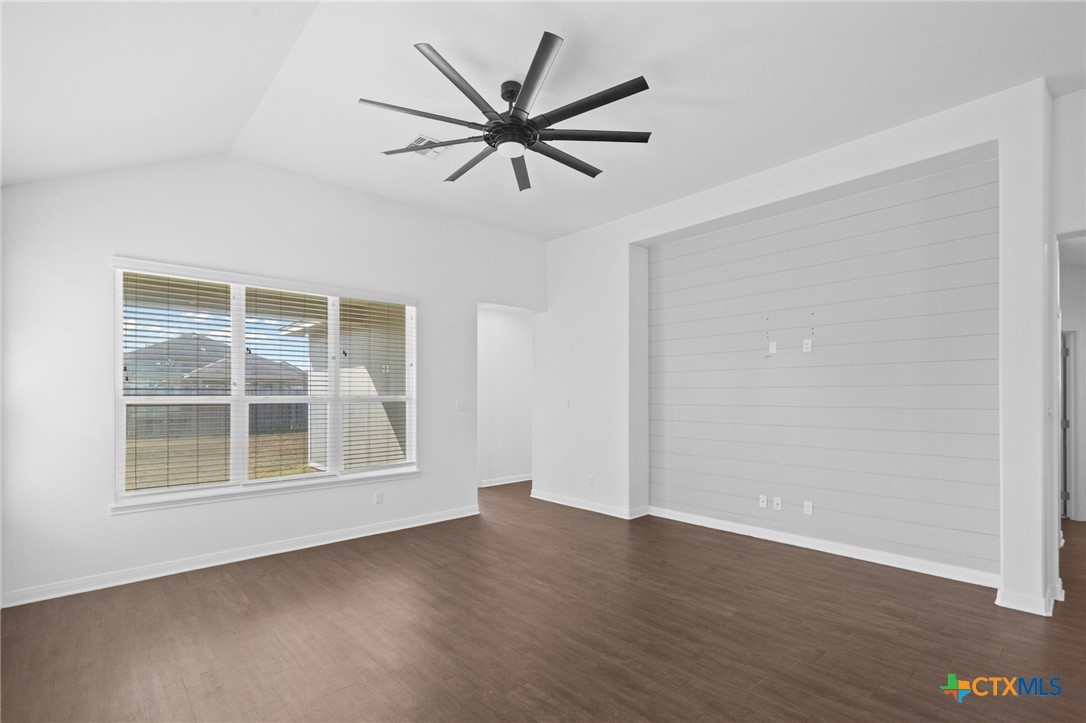 103 Dripping Spring Victoria, TX 77904 - Photo 9 of 27 a view of an empty room with wooden floor and a window