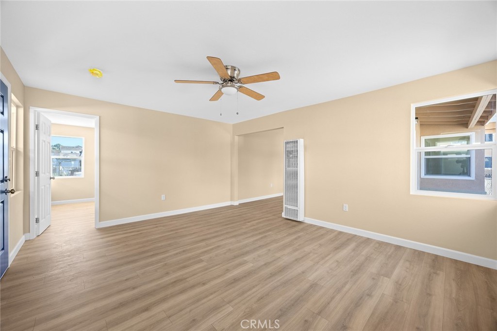 9734 Rio Hondo Parkway El Monte, CA 91733 - Photo 14 of 45 a view of an empty room with window and wooden floor