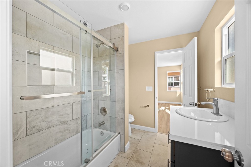 9734 Rio Hondo Parkway El Monte, CA 91733 - Photo 23 of 45 a bathroom with a shower sink and mirror