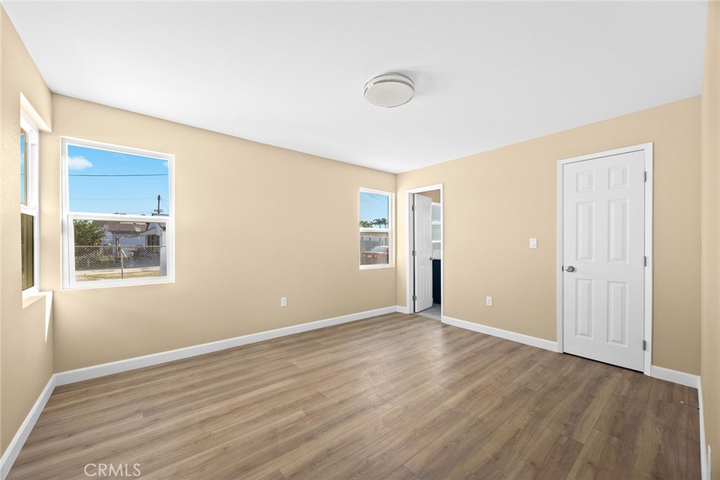 9734 Rio Hondo Parkway El Monte, CA 91733 - Photo 26 of 45 a view of an empty room with wooden floor and a window