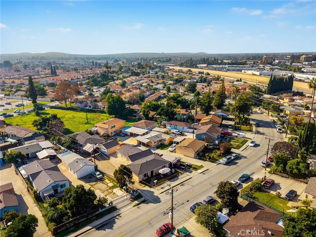 an aerial view of residential building and lake