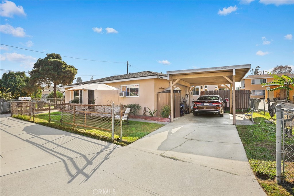 9734 Rio Hondo Parkway El Monte, CA 91733 - Photo 8 of 45 a view of a white house with swimming pool lawn chairs and a yard