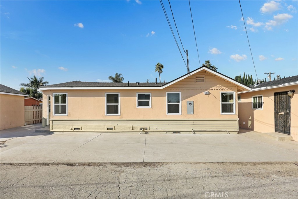 9734 Rio Hondo Parkway El Monte, CA 91733 - Photo 9 of 45 a front view of a house with a yard