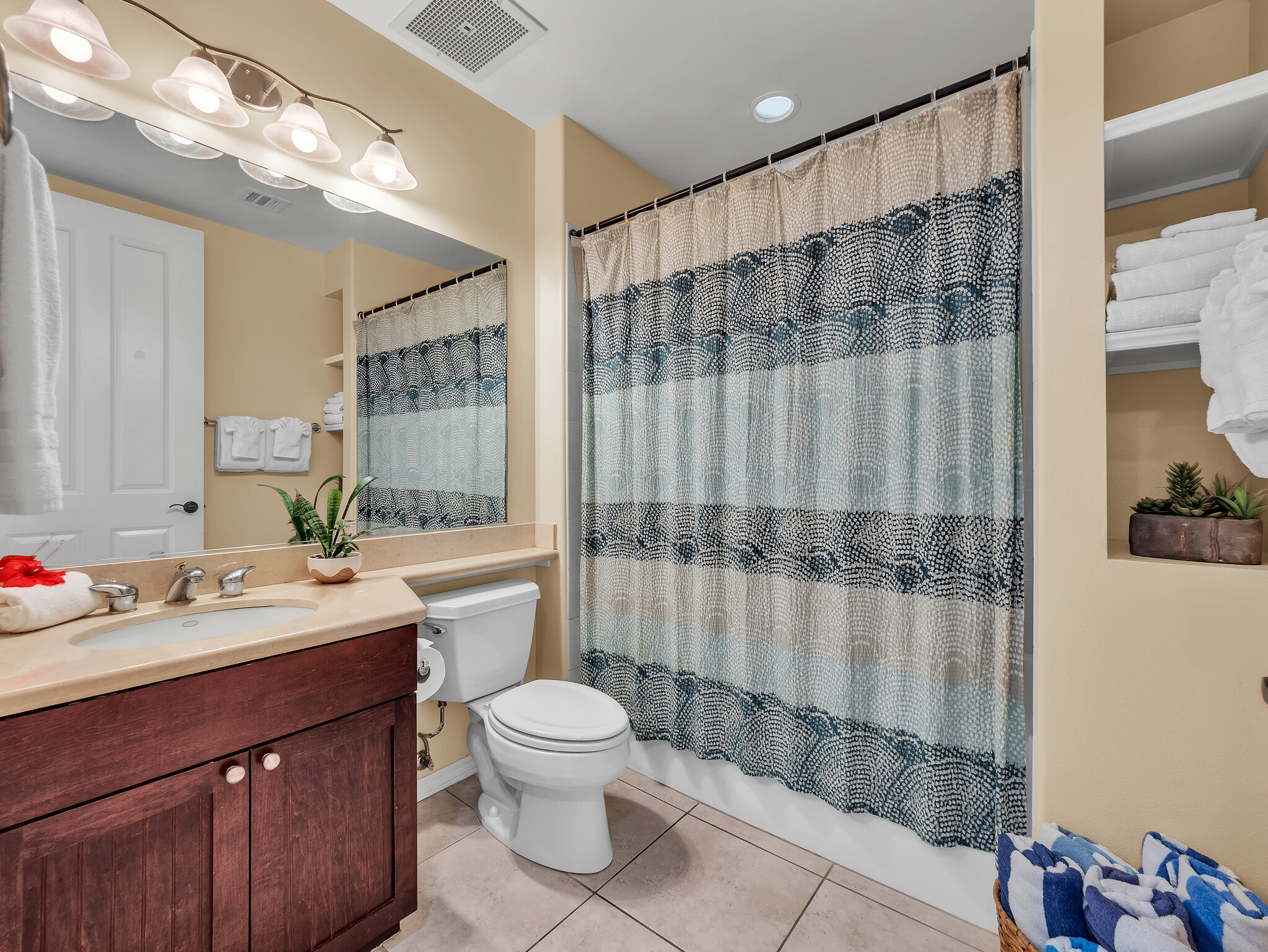 69-200 Pohakulana Place, Unit L4 Waikoloa, HI 96738 - Photo 12 of 29 a bathroom with a sink vanity mirror and toilet