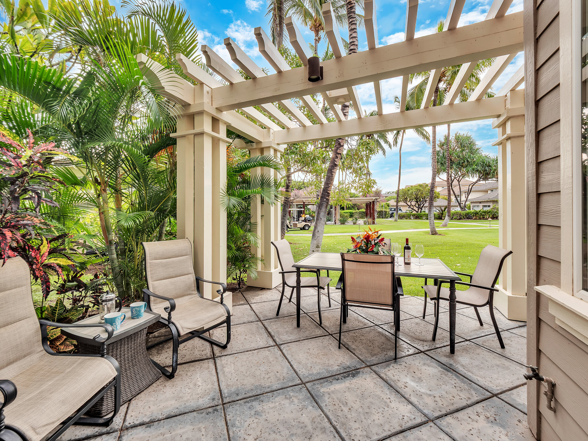 69-200 Pohakulana Place, Unit L4 Waikoloa, HI 96738 - Photo 21 of 29 a view of an chairs and table in the patio