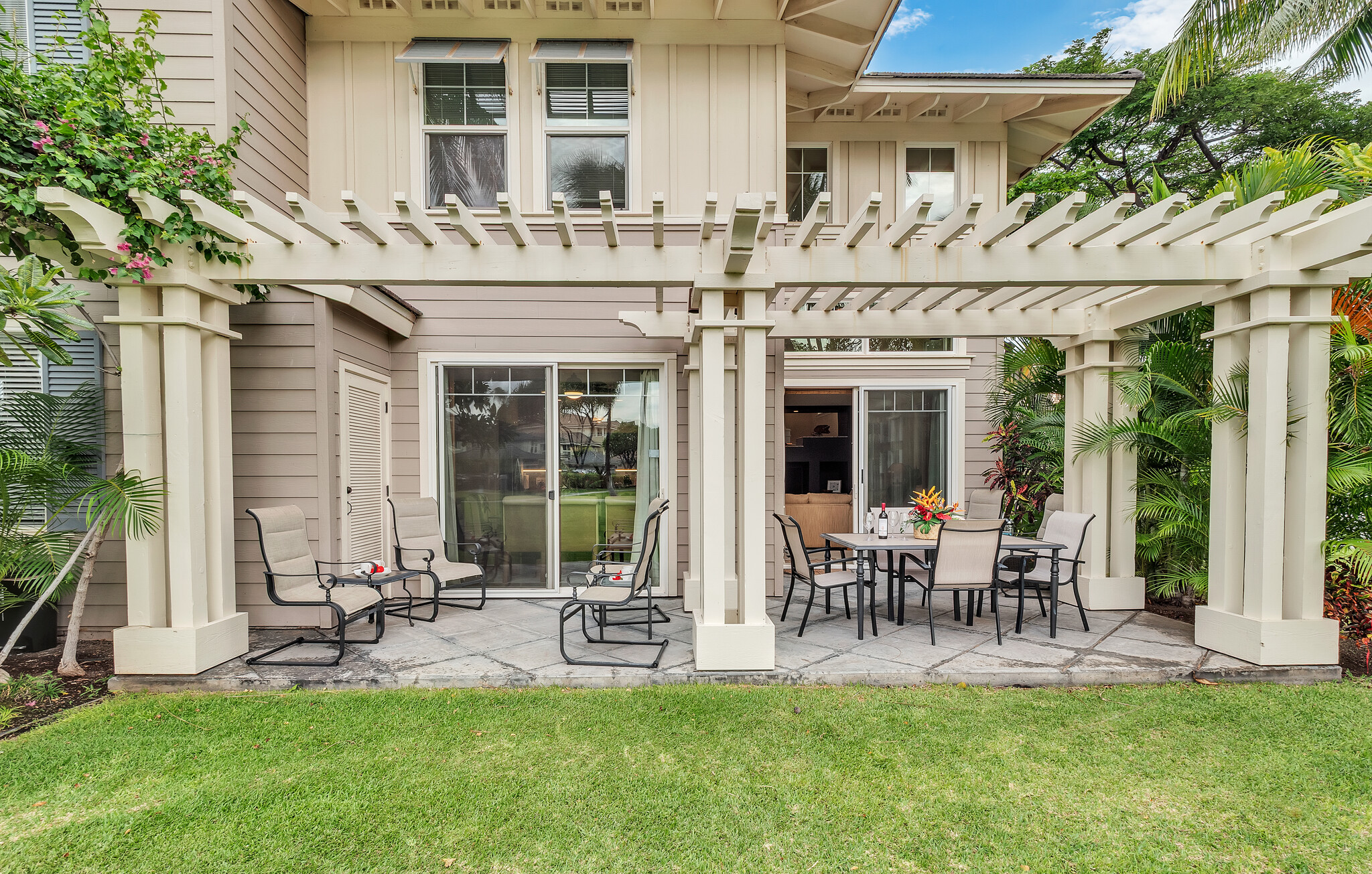 69-200 Pohakulana Place, Unit L4 Waikoloa, HI 96738 - Photo 23 of 29 a front view of a house with patio and garden