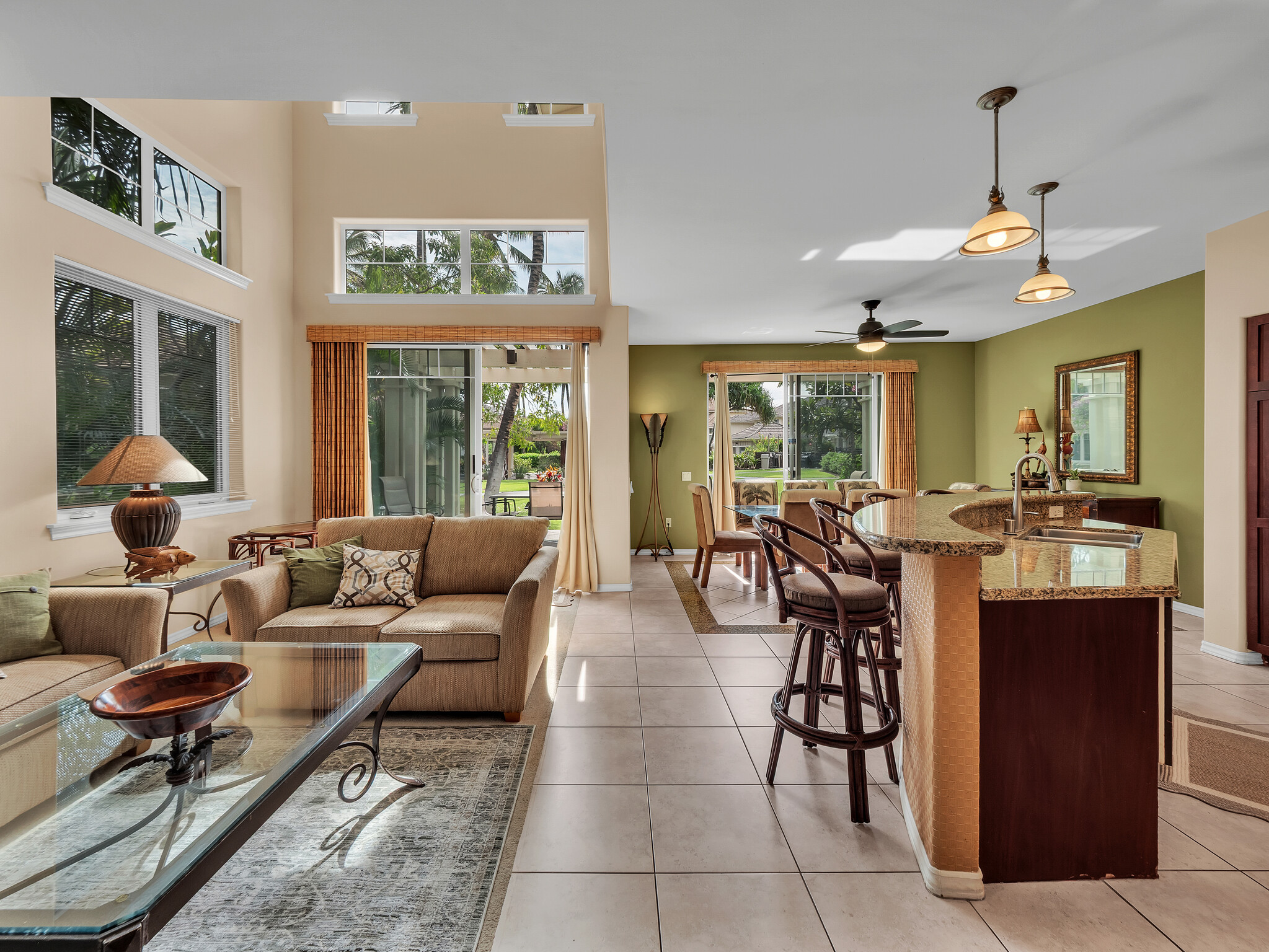 69-200 Pohakulana Place, Unit L4 Waikoloa, HI 96738 - Photo 3 of 29 a living room with furniture potted plant and kitchen view