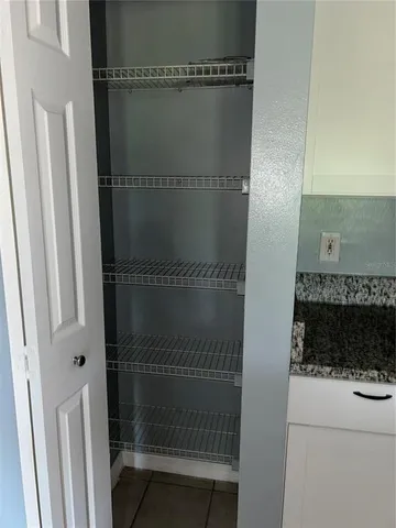 a bathroom with a window and a shower