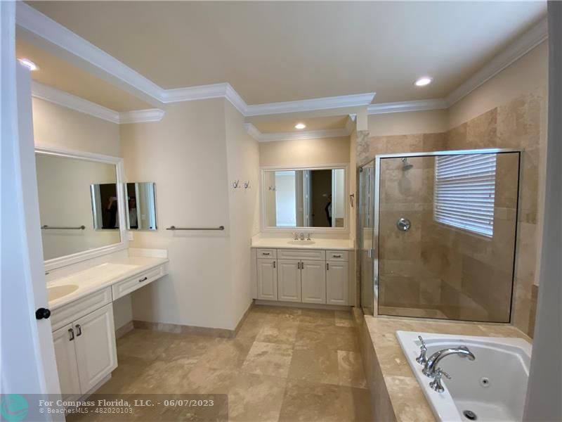 105 Via Floresta Drive Boca Raton, FL 33487 - Photo 12 of 26 a bathroom with a sink a toilet and shower