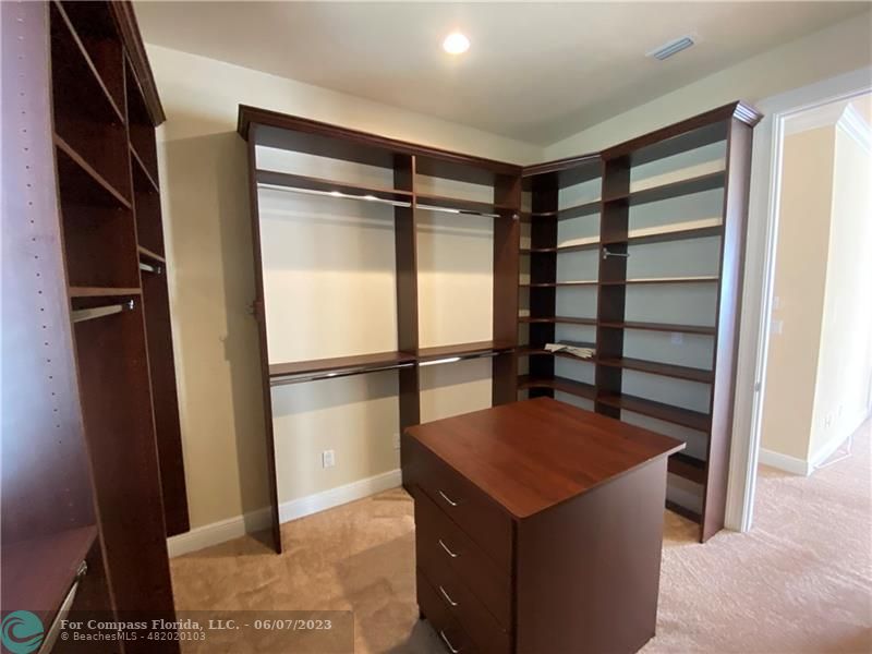 105 Via Floresta Drive Boca Raton, FL 33487 - Photo 13 of 26 a kitchen with stainless steel appliances a refrigerator and a stove