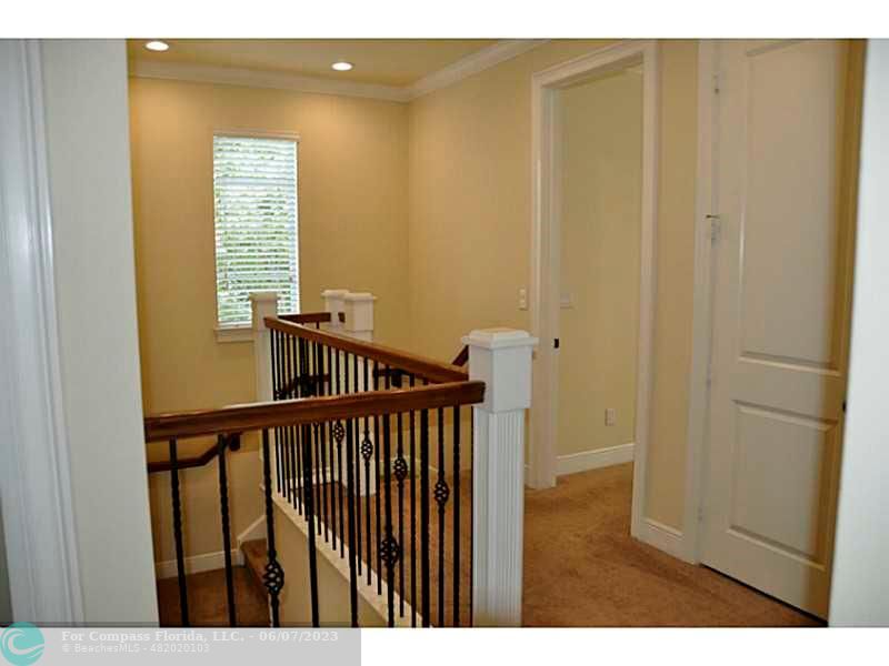 105 Via Floresta Drive Boca Raton, FL 33487 - Photo 16 of 26 a view of balcony with wooden floor
