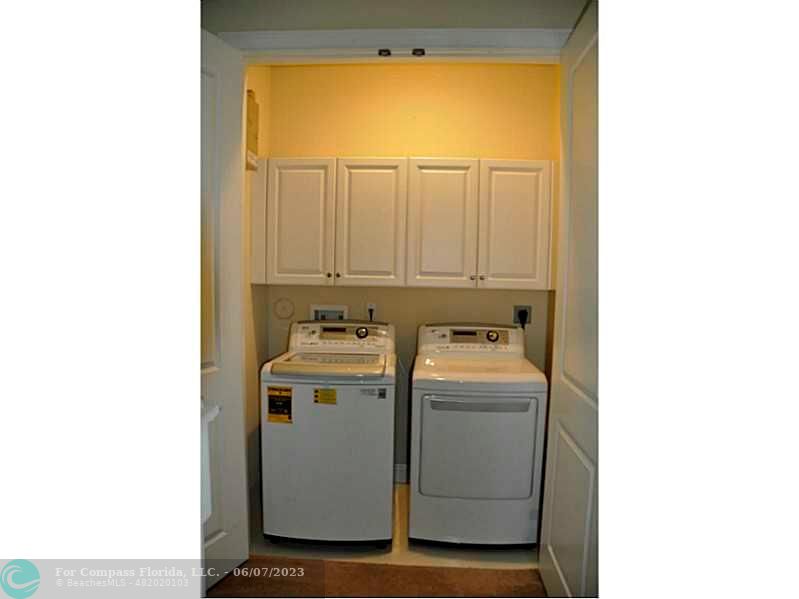 105 Via Floresta Drive Boca Raton, FL 33487 - Photo 17 of 26 a utility room with dryer and washer