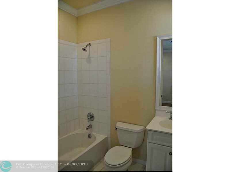105 Via Floresta Drive Boca Raton, FL 33487 - Photo 20 of 26 a bathroom with a toilet and a shower
