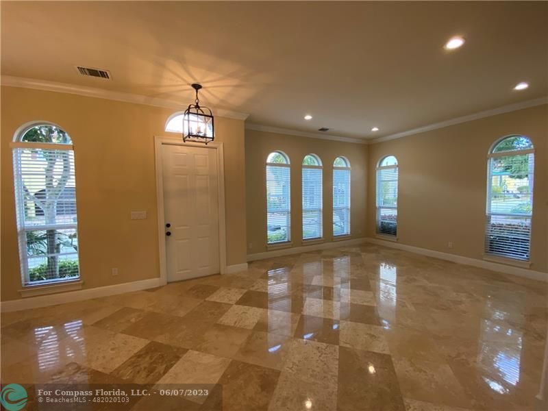105 Via Floresta Drive Boca Raton, FL 33487 - Photo 2 of 26 a view of an entryway of a hall with a window