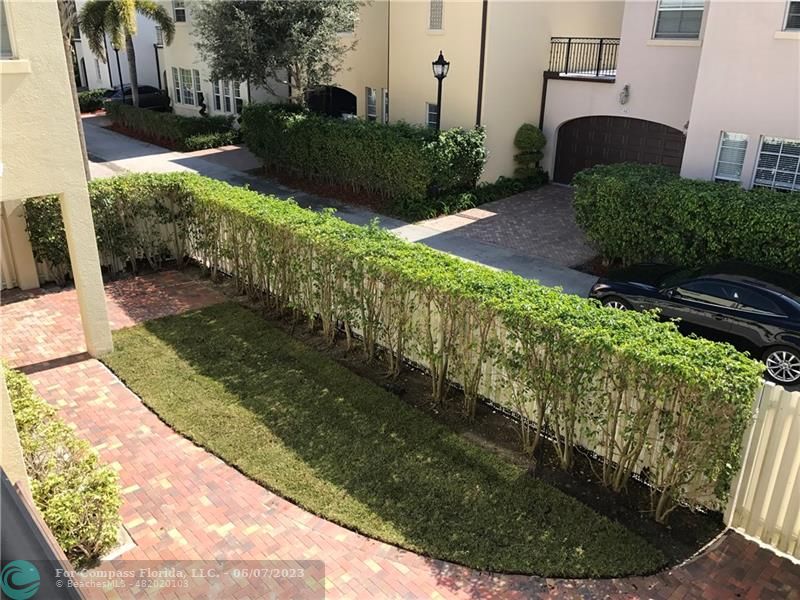 105 Via Floresta Drive Boca Raton, FL 33487 - Photo 24 of 26 a view of a garden with a patio