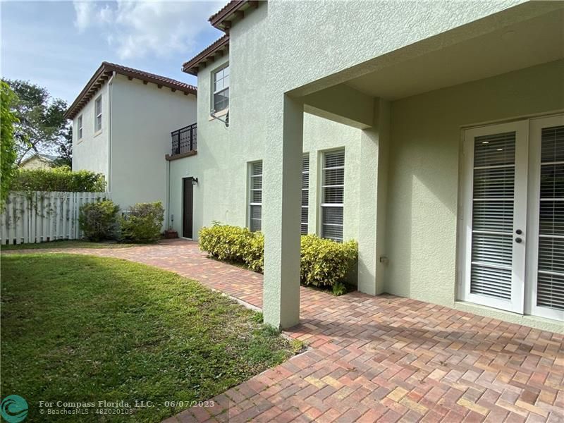 105 Via Floresta Drive Boca Raton, FL 33487 - Photo 26 of 26 front view of a house with a yard