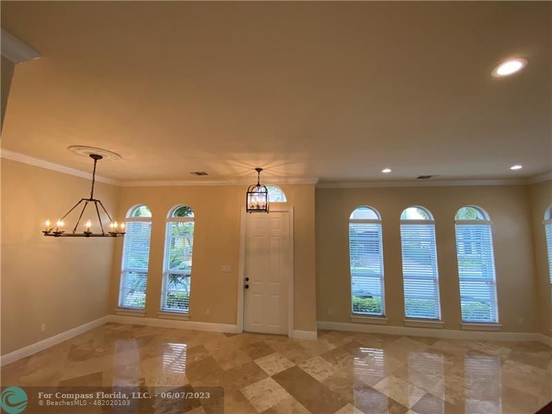 105 Via Floresta Drive Boca Raton, FL 33487 - Photo 3 of 26 a view of a big room with a chandelier