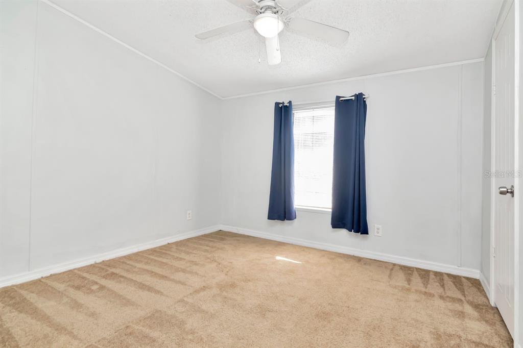 10404 Hawk Court Riverview, FL 33578 - Photo 25 of 38 a view of an empty room with a window