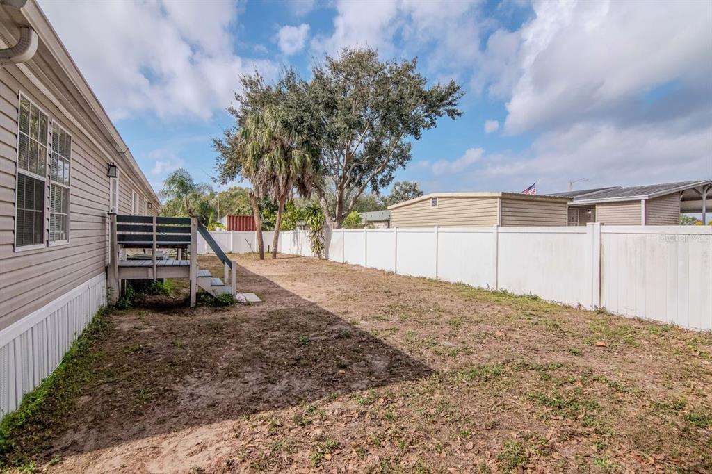 10404 Hawk Court Riverview, FL 33578 - Photo 33 of 38 a backyard of a house with a basket ball court