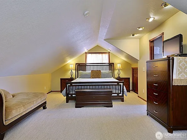 a bedroom with bed and window